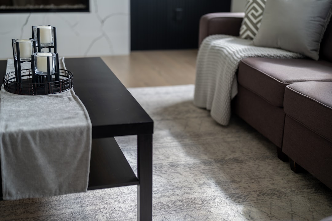 Bright living room with dark wood floors and cream sofa