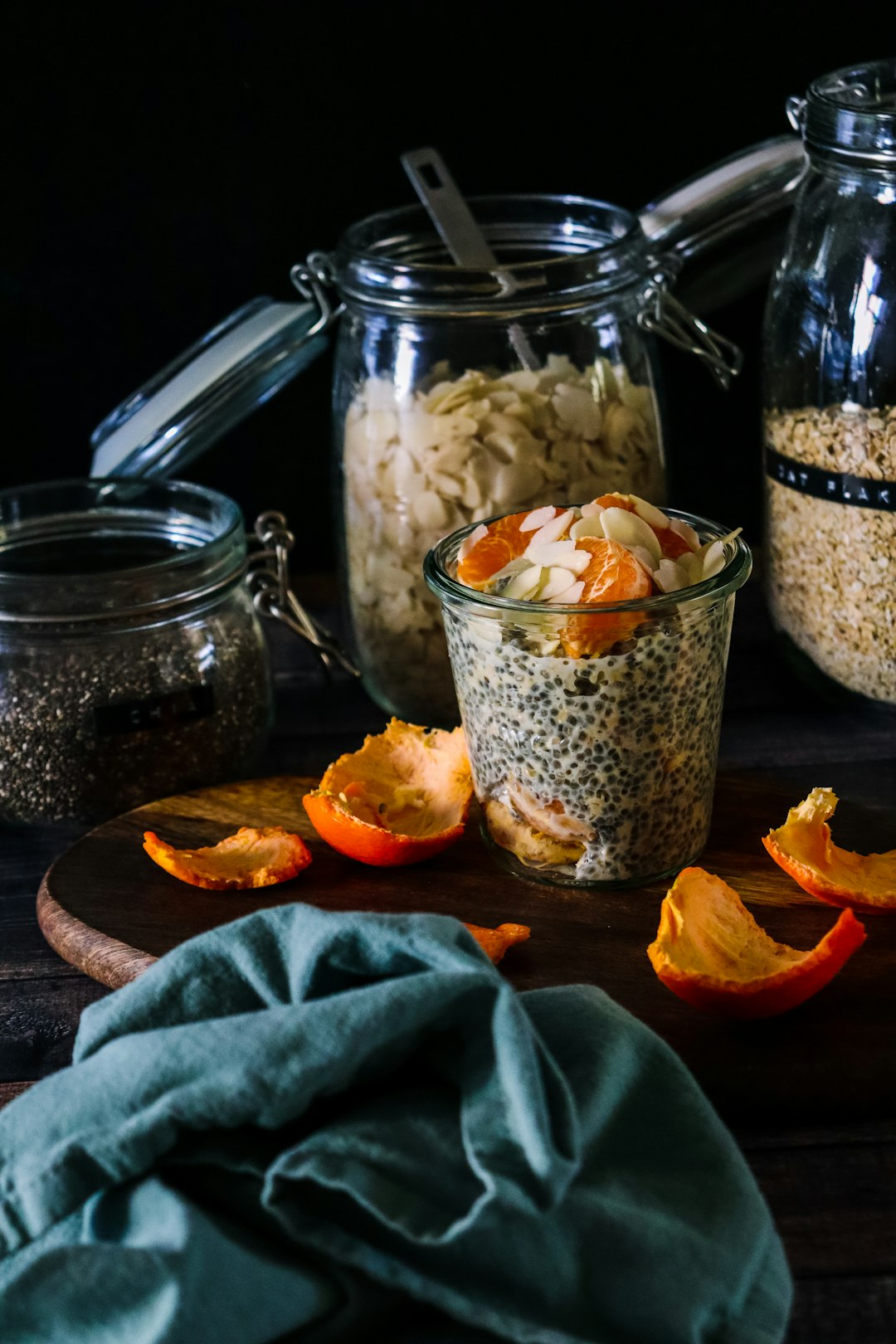 Colorful high-fiber meal prep jars and bowls on marble