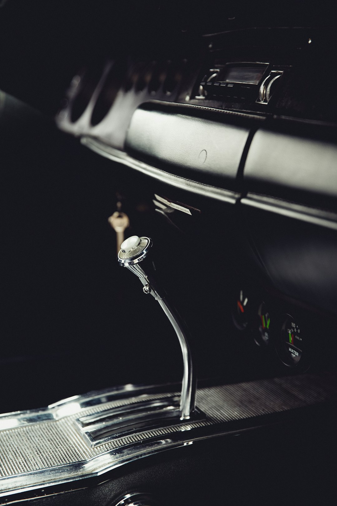 Vintage manual gearshift and pedals in classic car