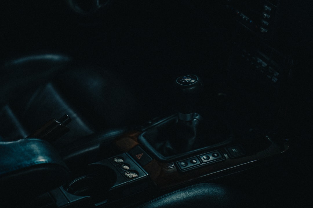 Manual gearshift knob inside a car interior