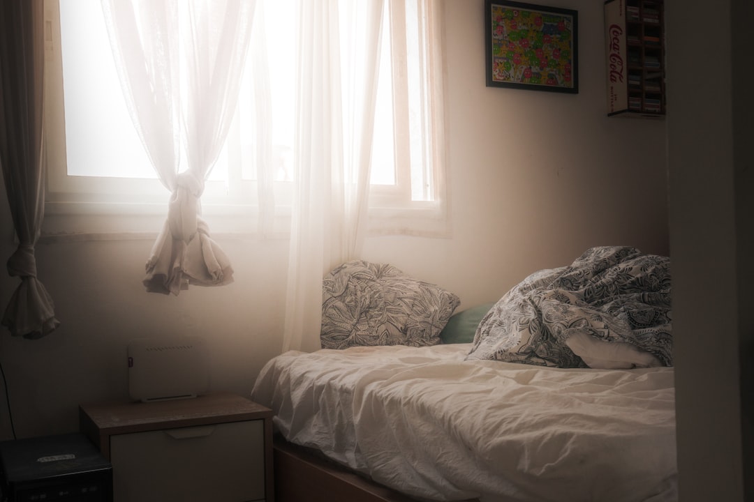Calm teenage bedroom bathed in warm golden light