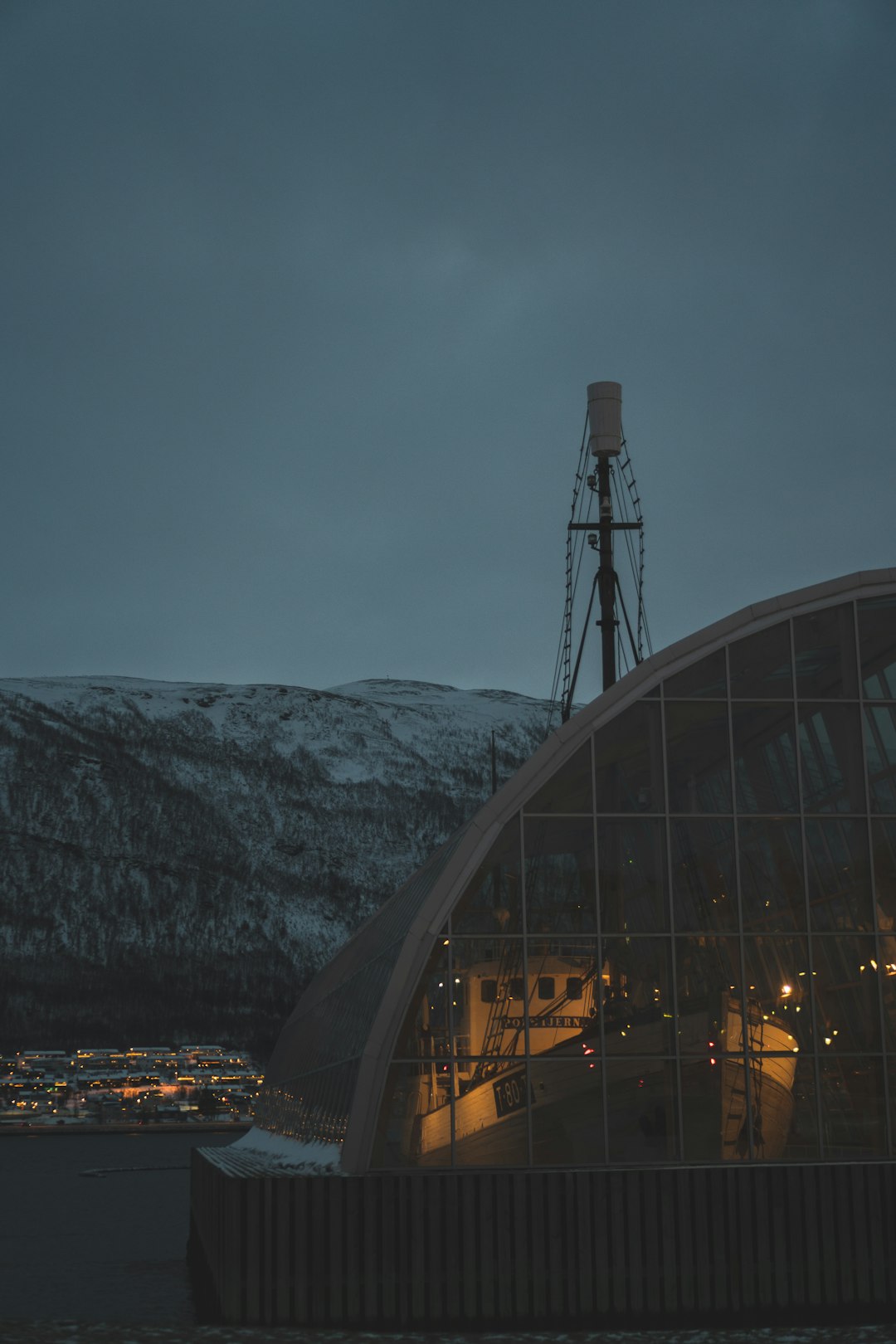 Satellite terminal on snowy rooftop under starry sky