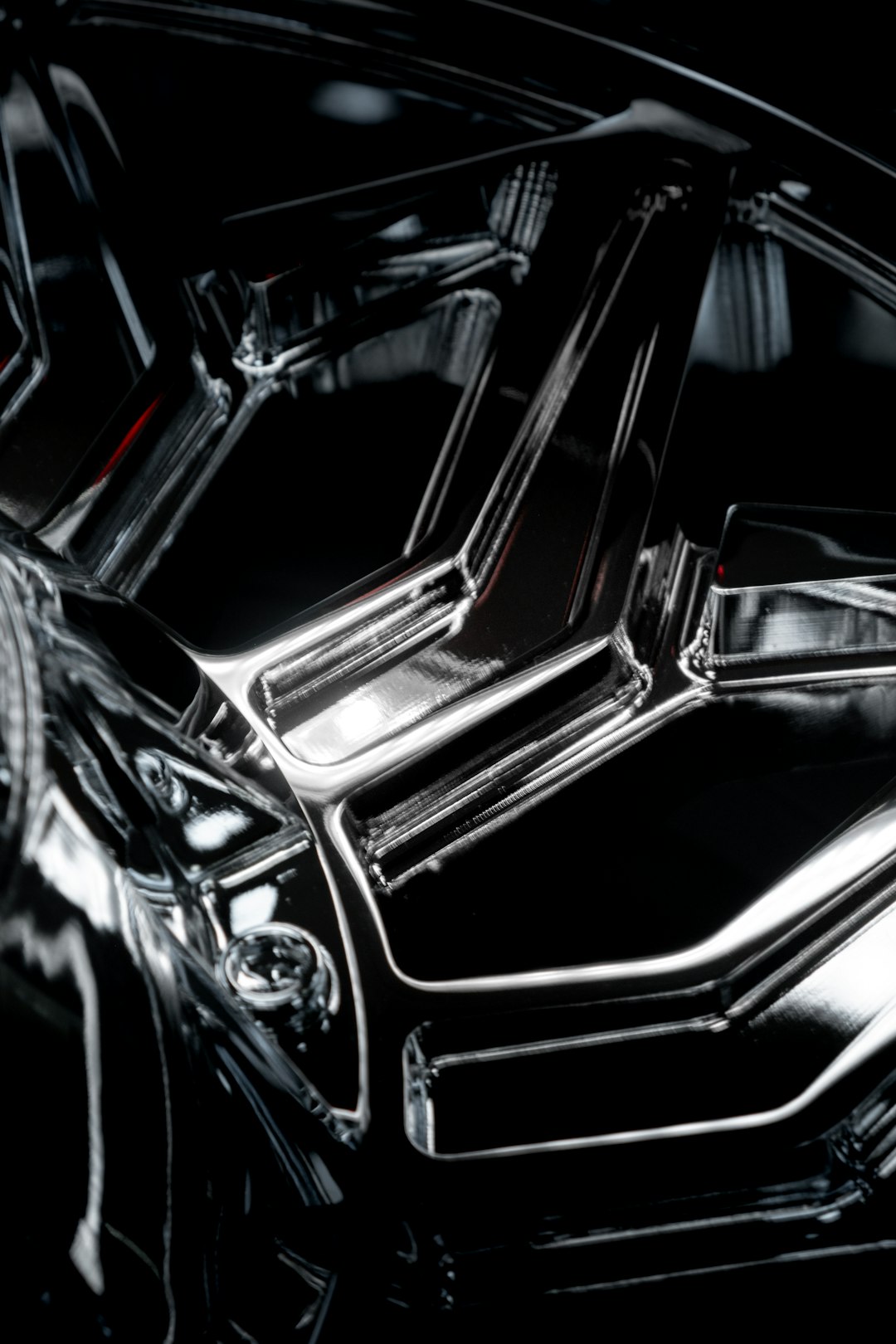 Aluminum megacast car component in dramatic studio lighting