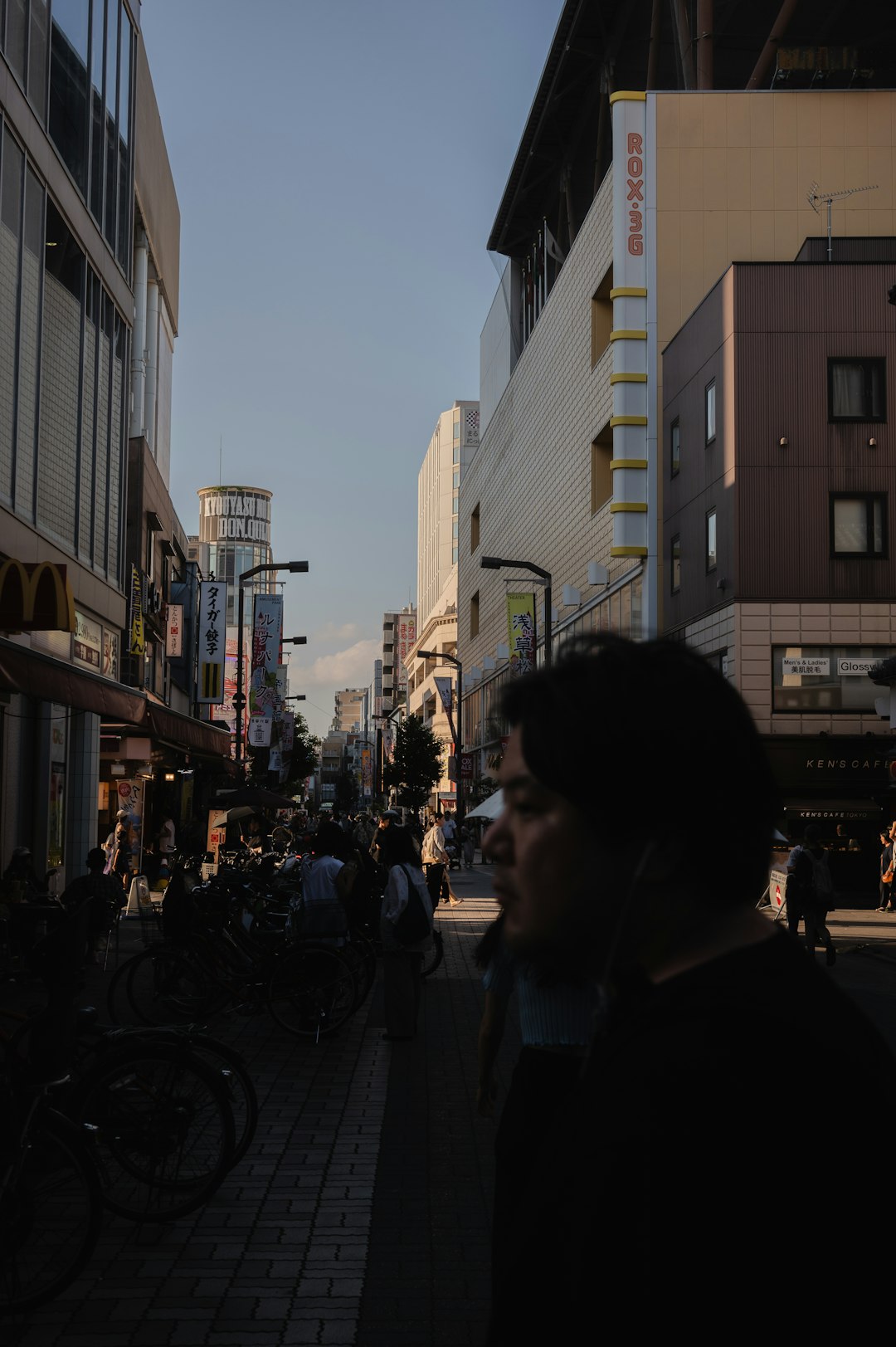 Person wearing XR smart glasses on a city street