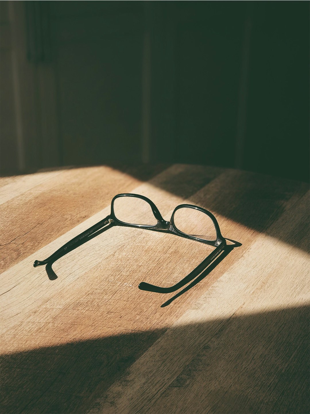 Sleek XR smart glasses resting near a window