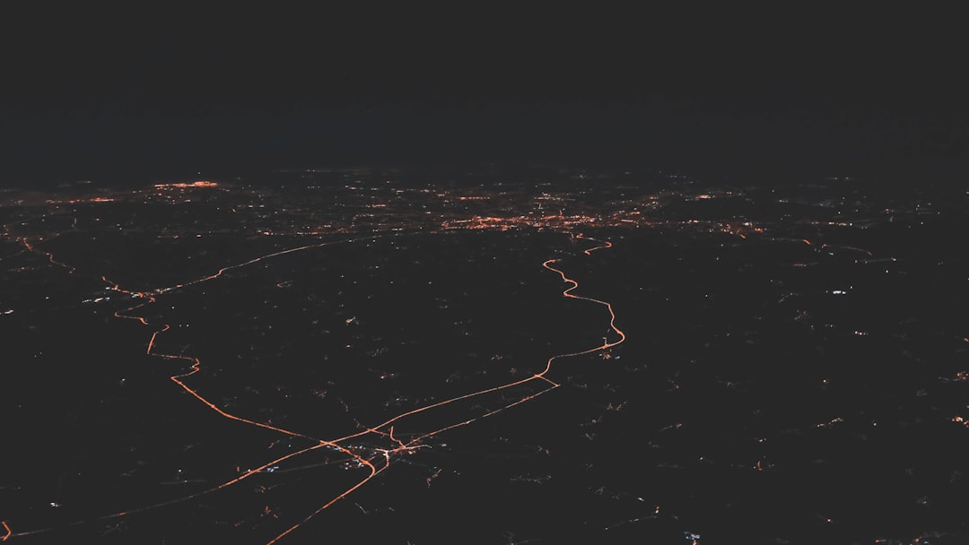 GPS satellite network orbiting above Earth at night