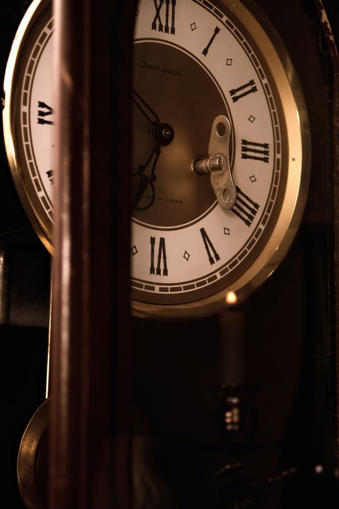 Antique pendulum clock illustrating gravity's effect on timekeeping