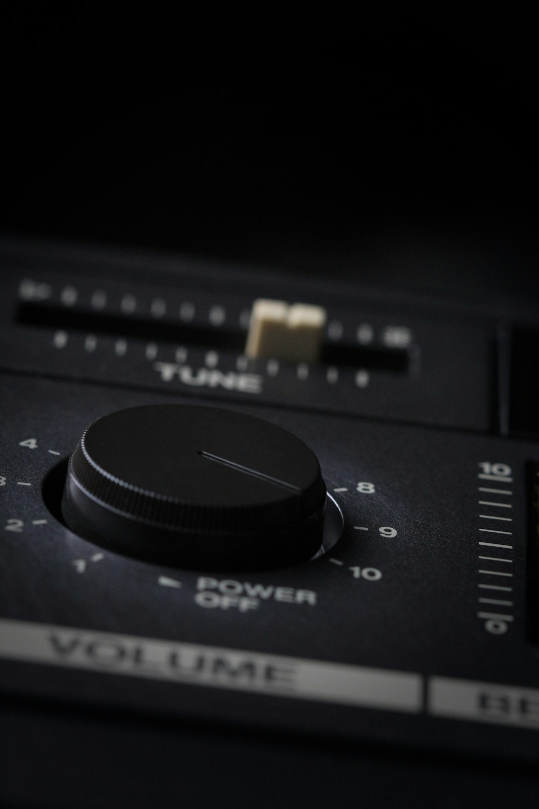Vintage analog volume knob with dramatic side lighting