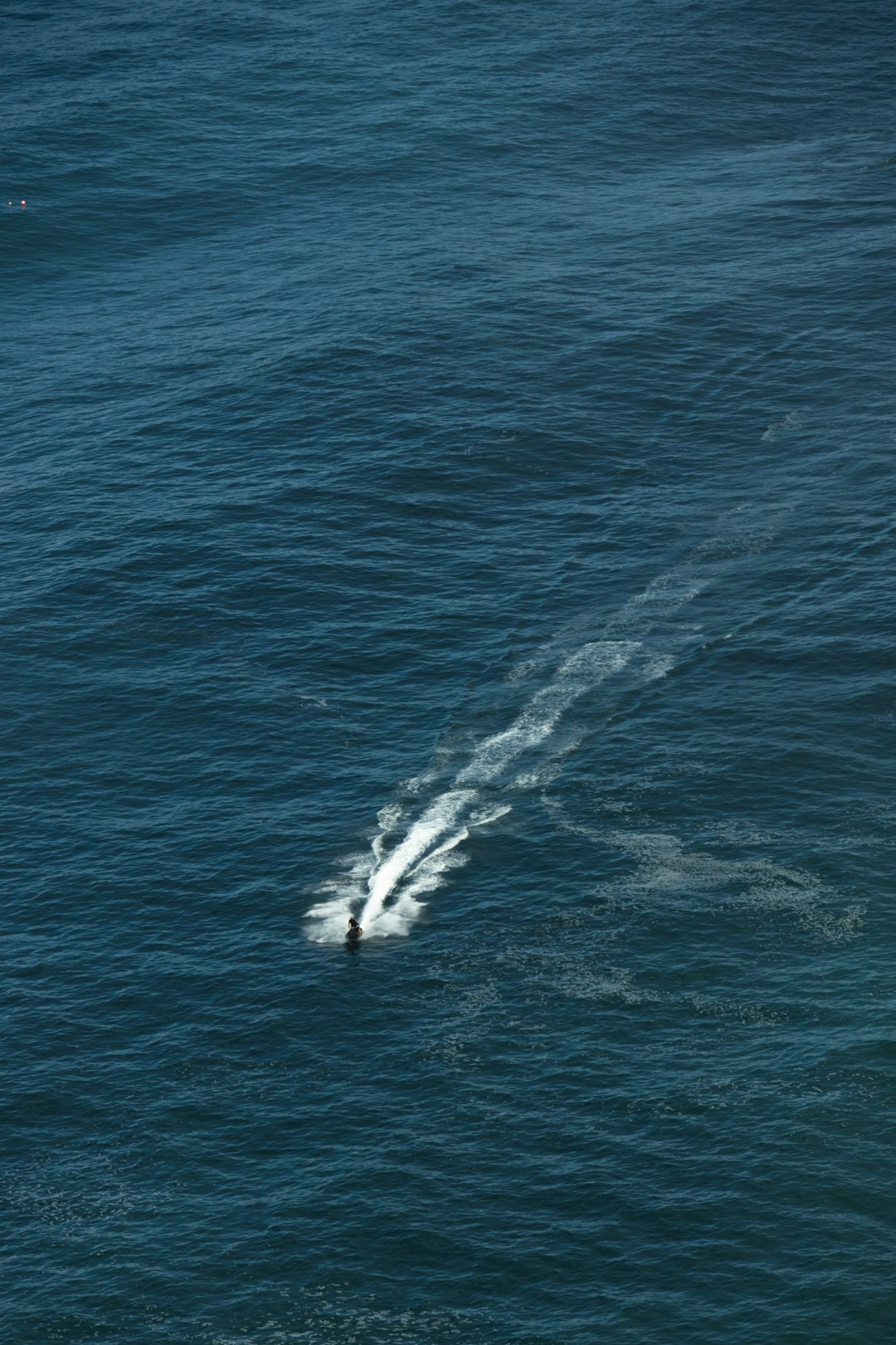 ROV descending into deep ocean darkness