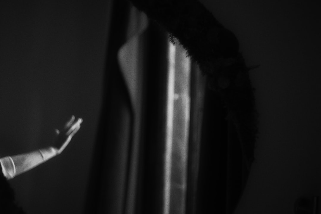 Human hand and robotic arm reaching toward each other
