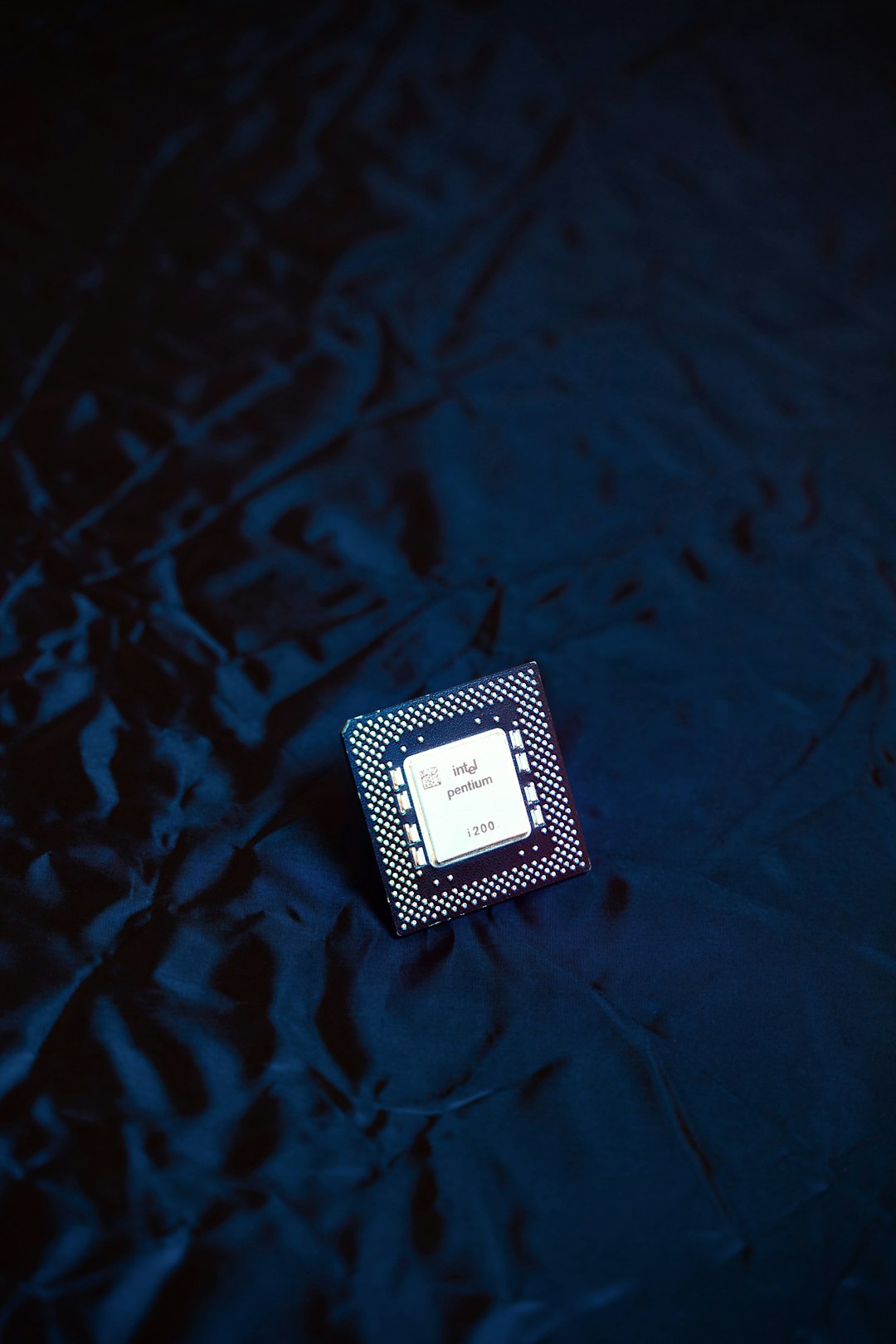 Modern computer processor chip on dark reflective surface