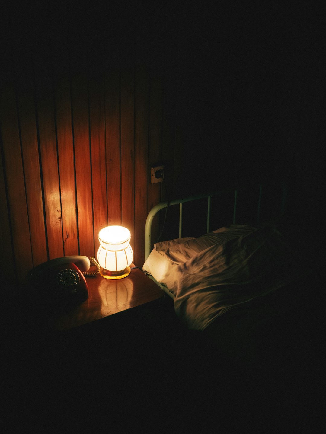Alarm clock on nightstand in warm morning light