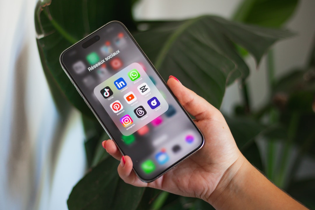 Hand holding phone with green battery icon