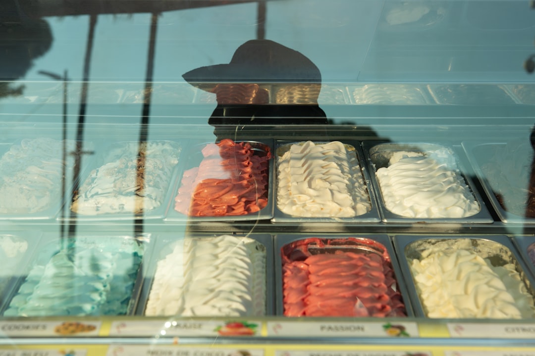 Colorful ice cream cones at a sunny parlor counter