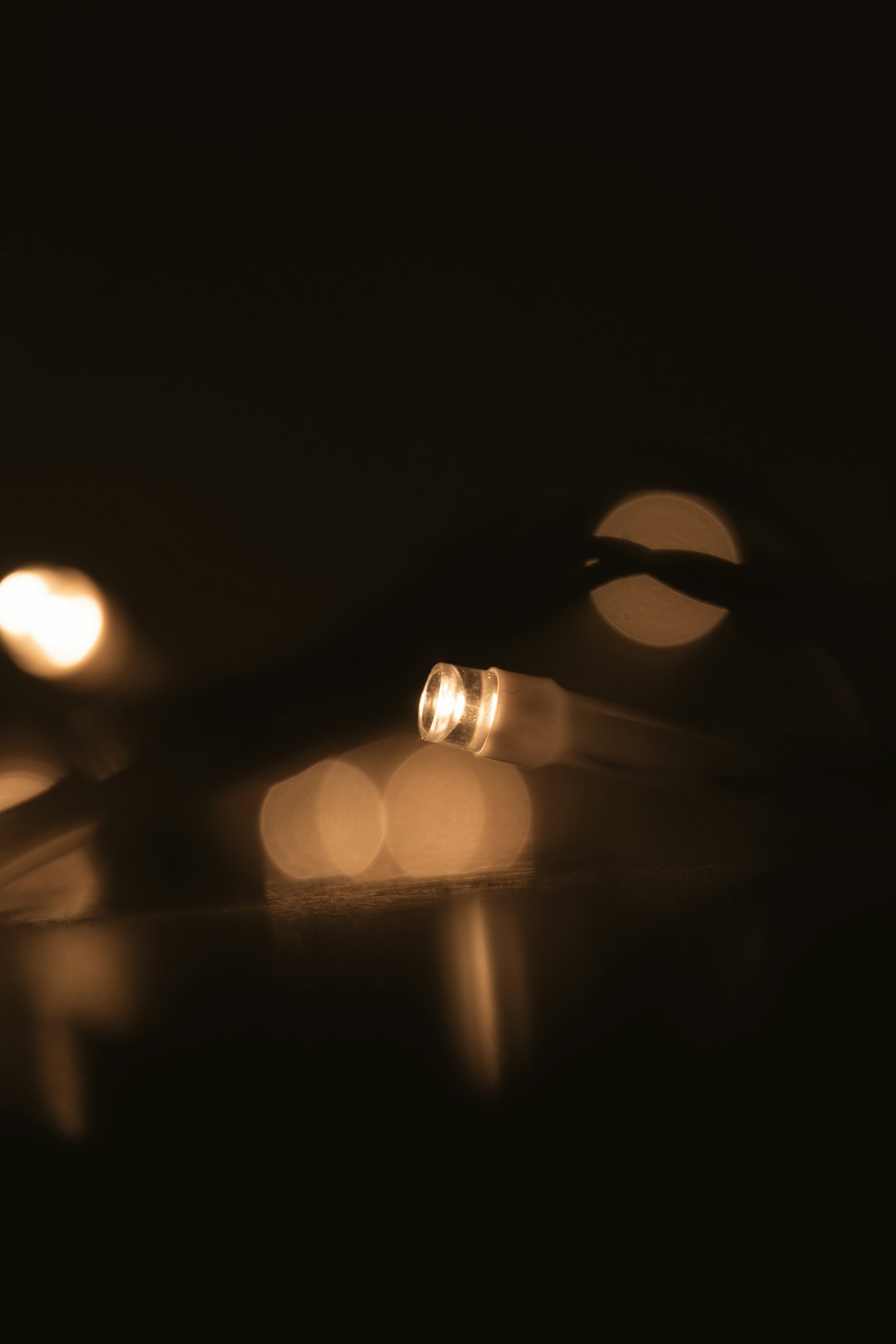 Gold ring standing upright with gold dust in light