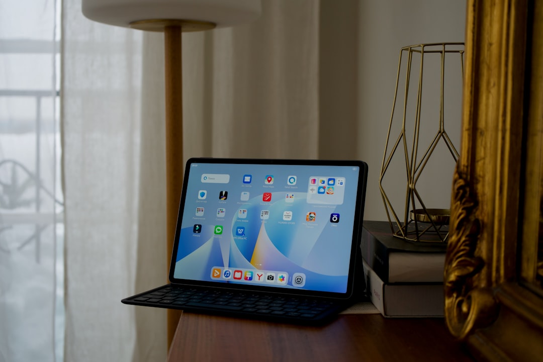 Tablet and laptop side by side on a desk