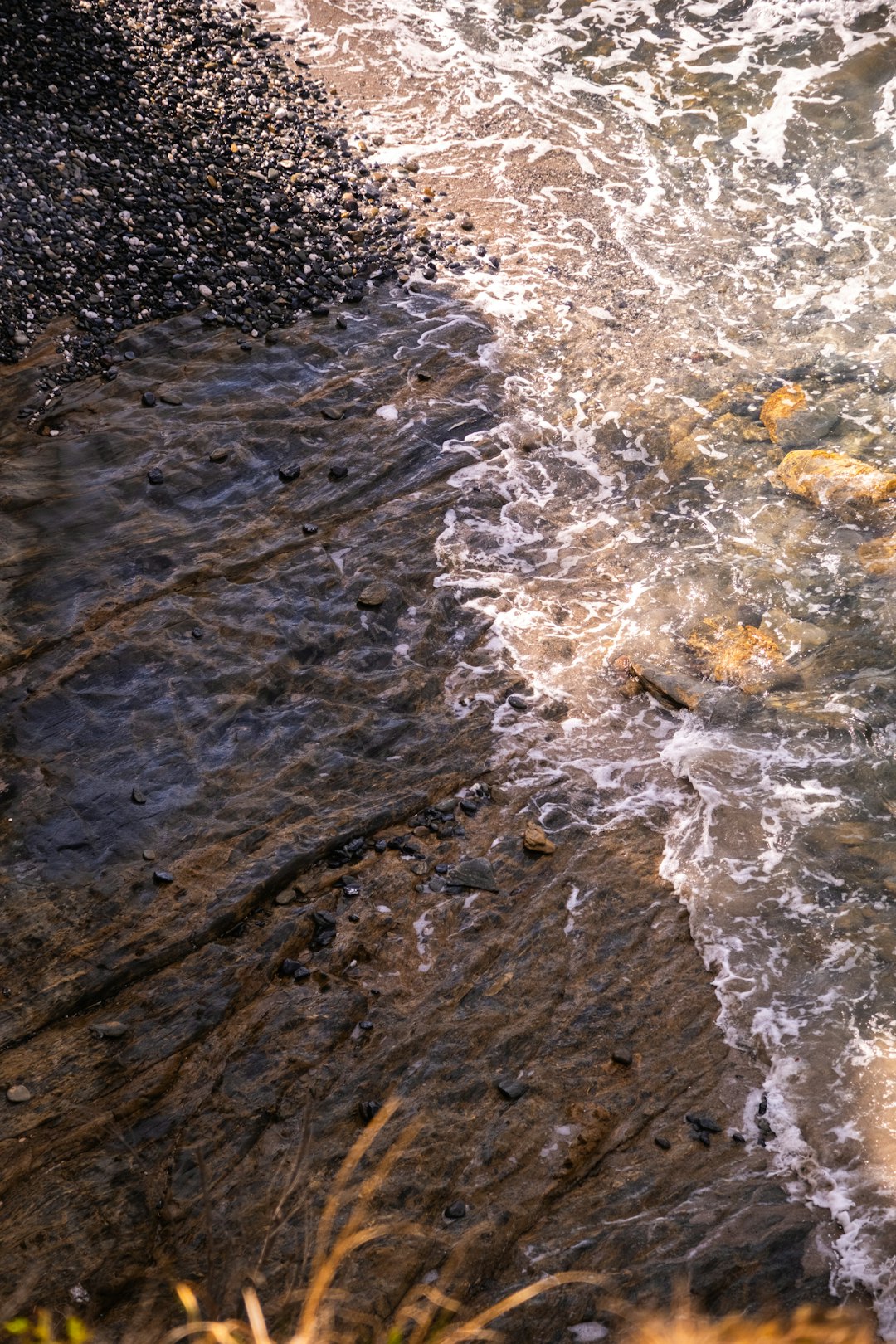 Water rushing through penstock outlet at dam base