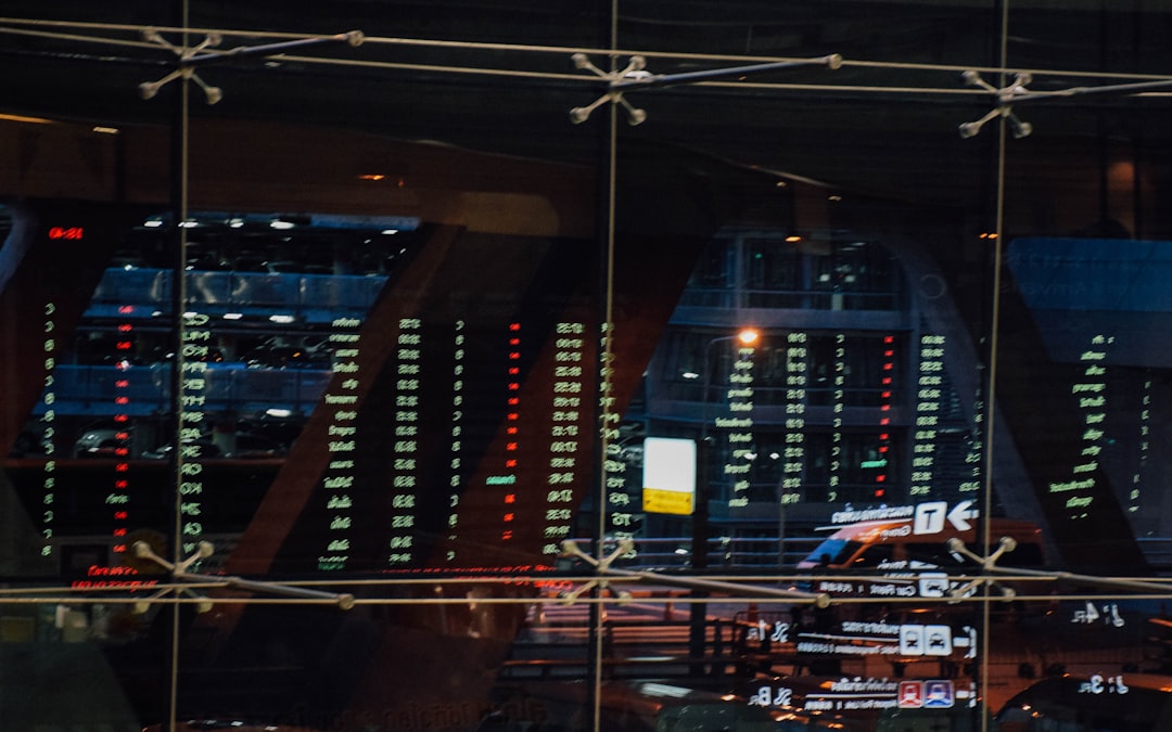 Busy prediction market trading floor with probability screens