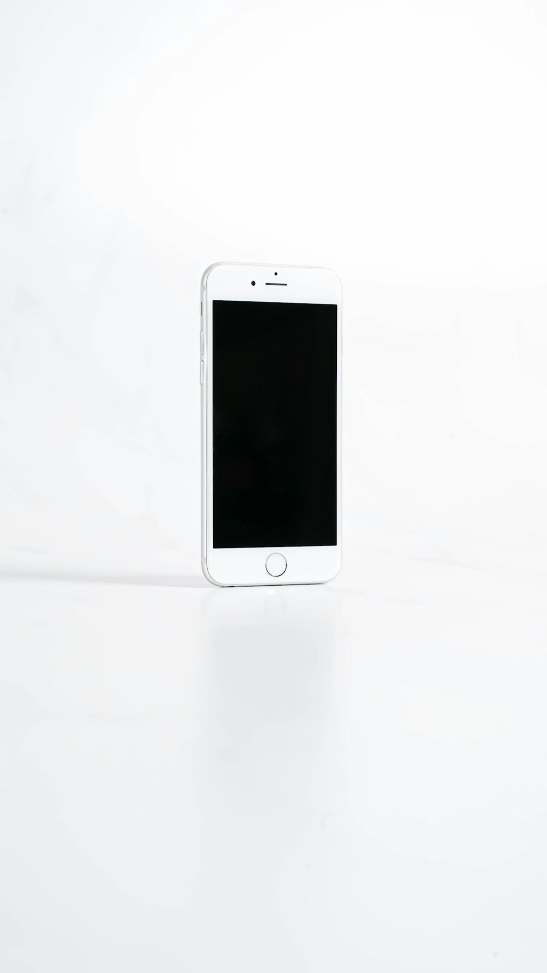 Smartphone showing profile photo on white surface