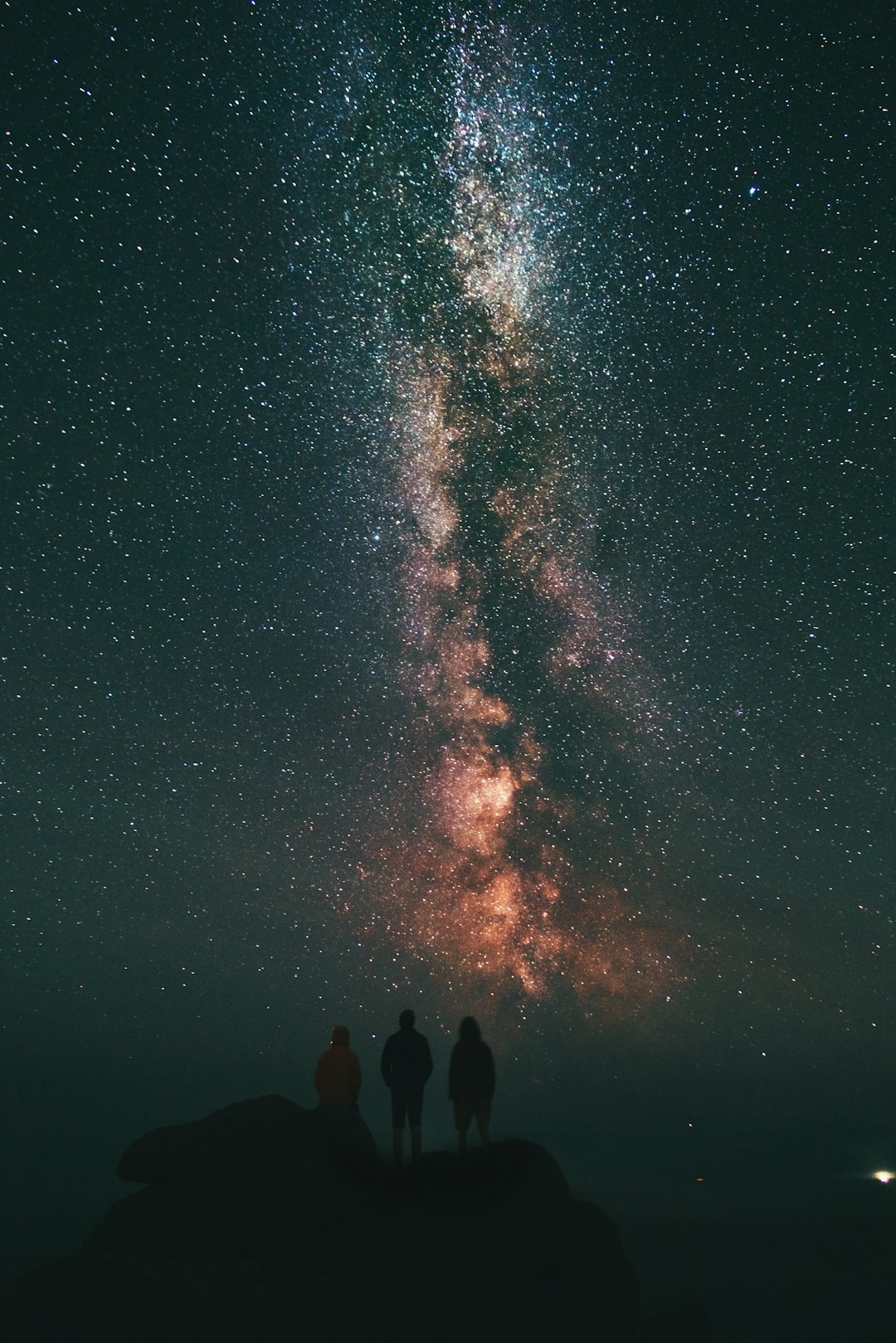 Spacesuit standing against starfield background