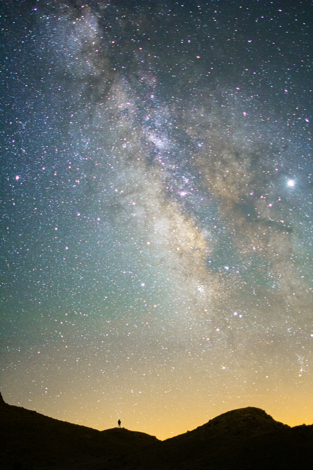 Interstellar object silhouetted against vast galaxy