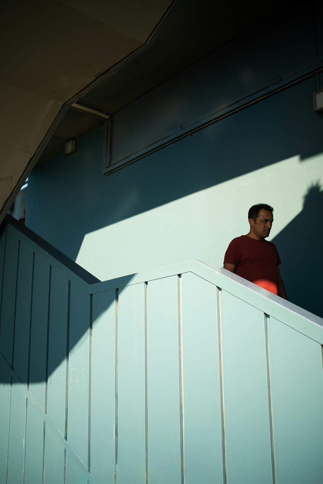 Person doing a lunge in a sunlit home hallway
