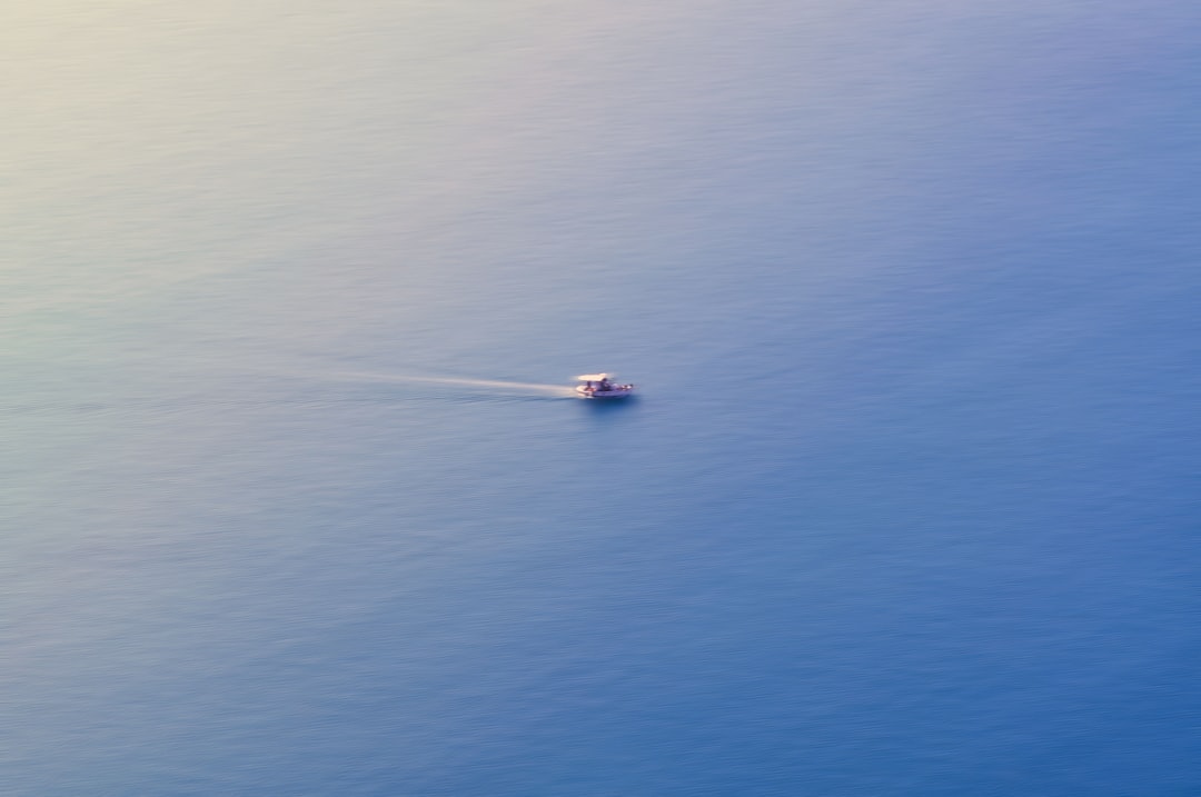 Space capsule floating in ocean at dawn