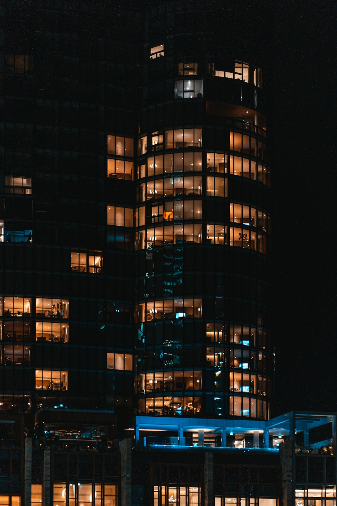 Data center building at night reflected in still water