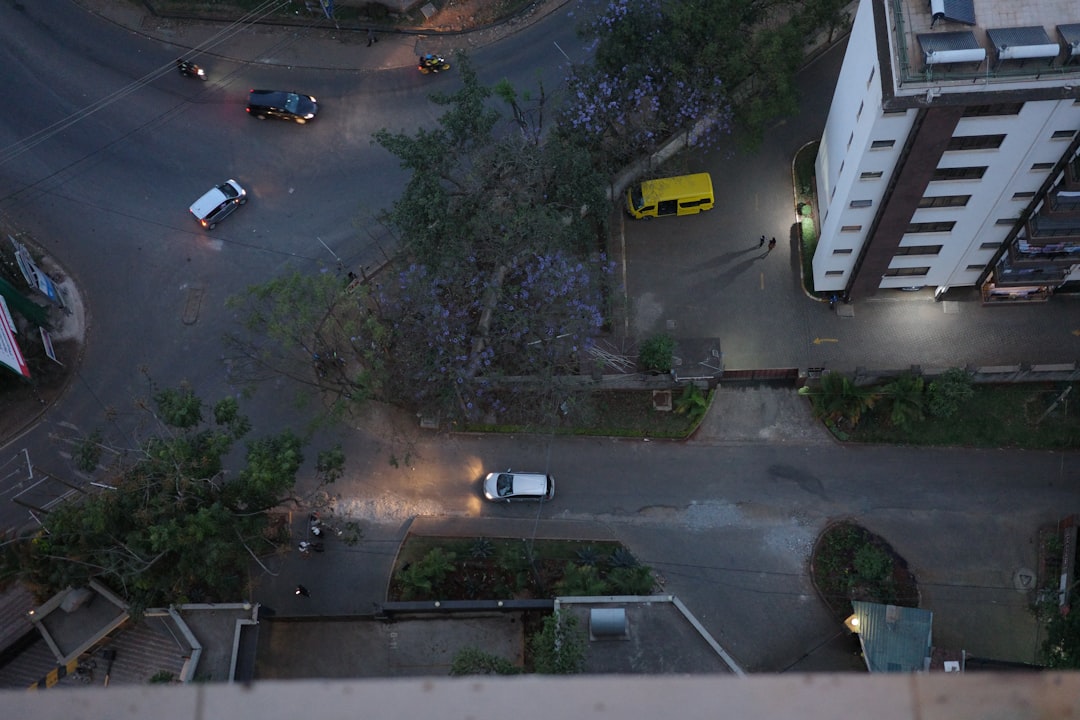 Busy city intersection with ride-share cars and cyclists