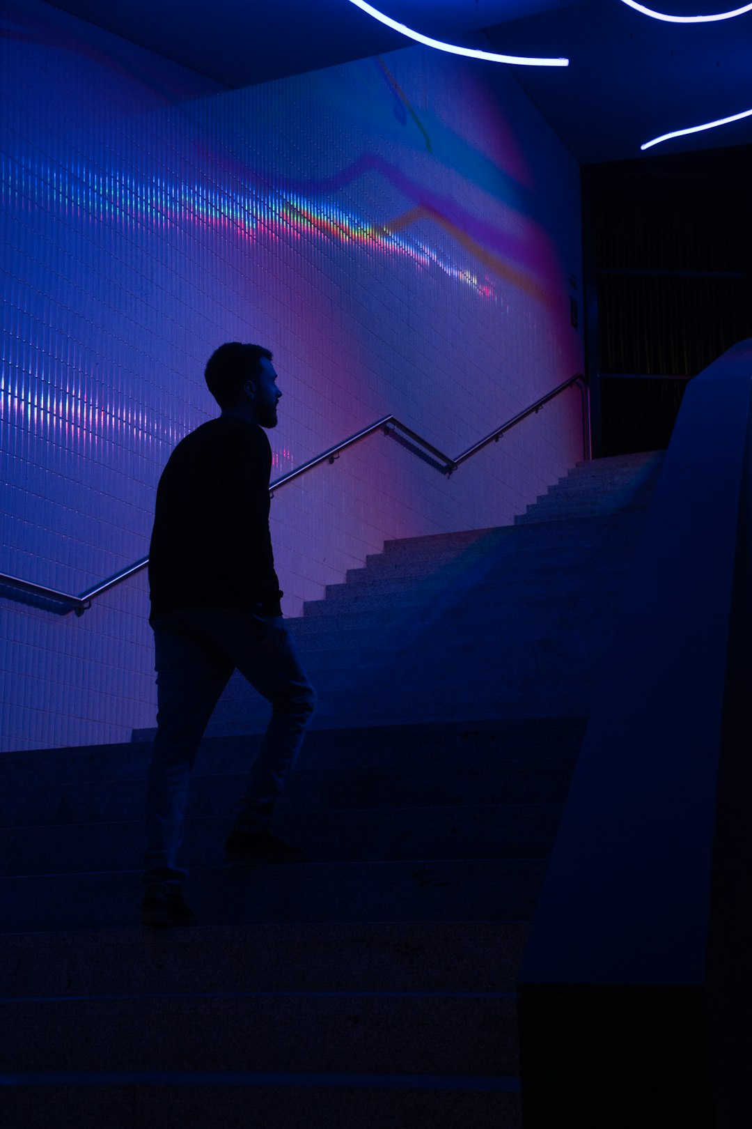 Scientist silhouette before glowing genomic data screen