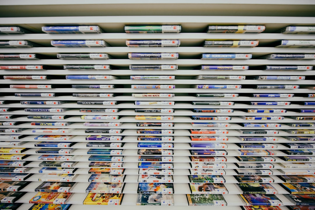 Physical game boxes next to a digital storefront display