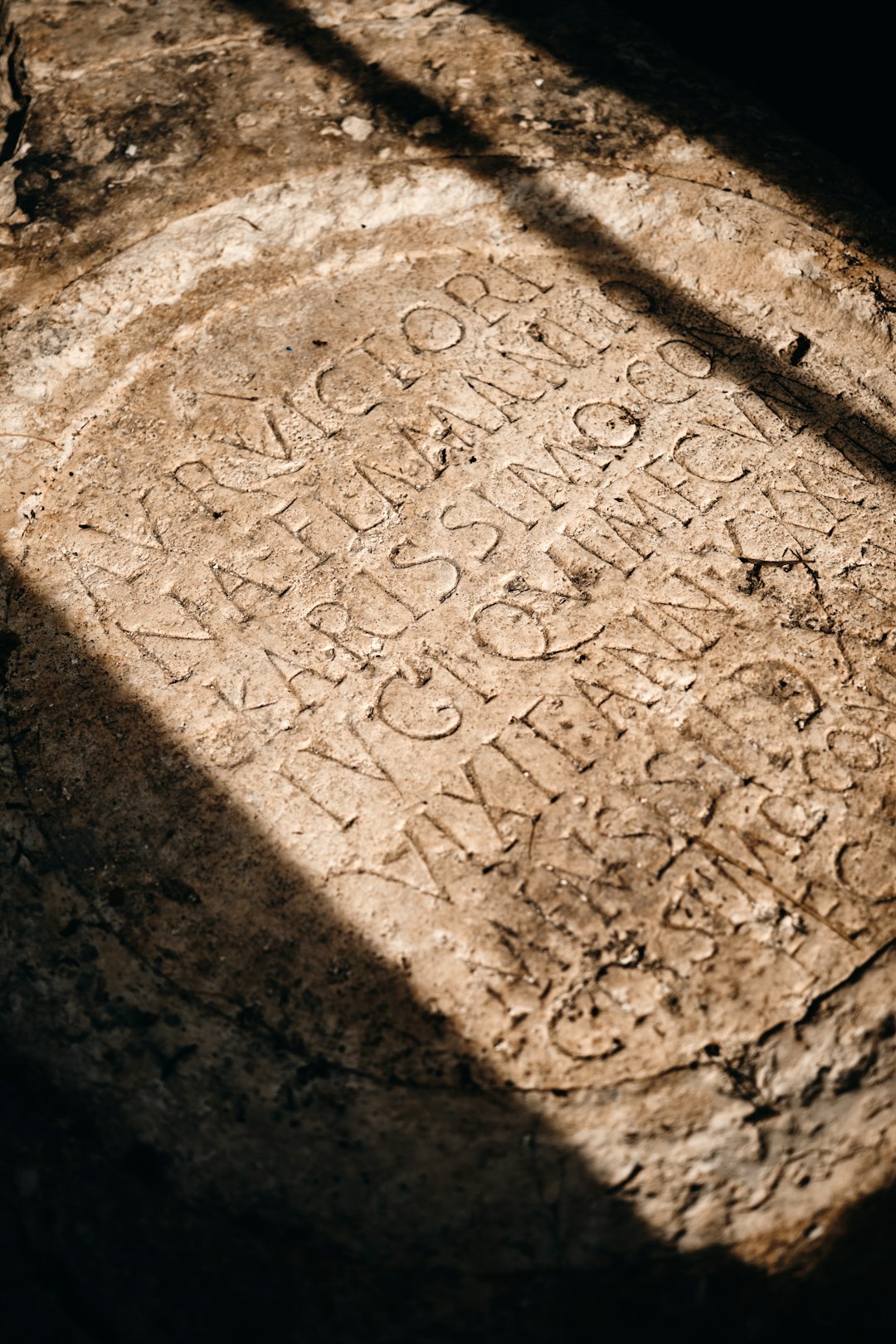 Ancient stone cylinder seal resting on aged parchment