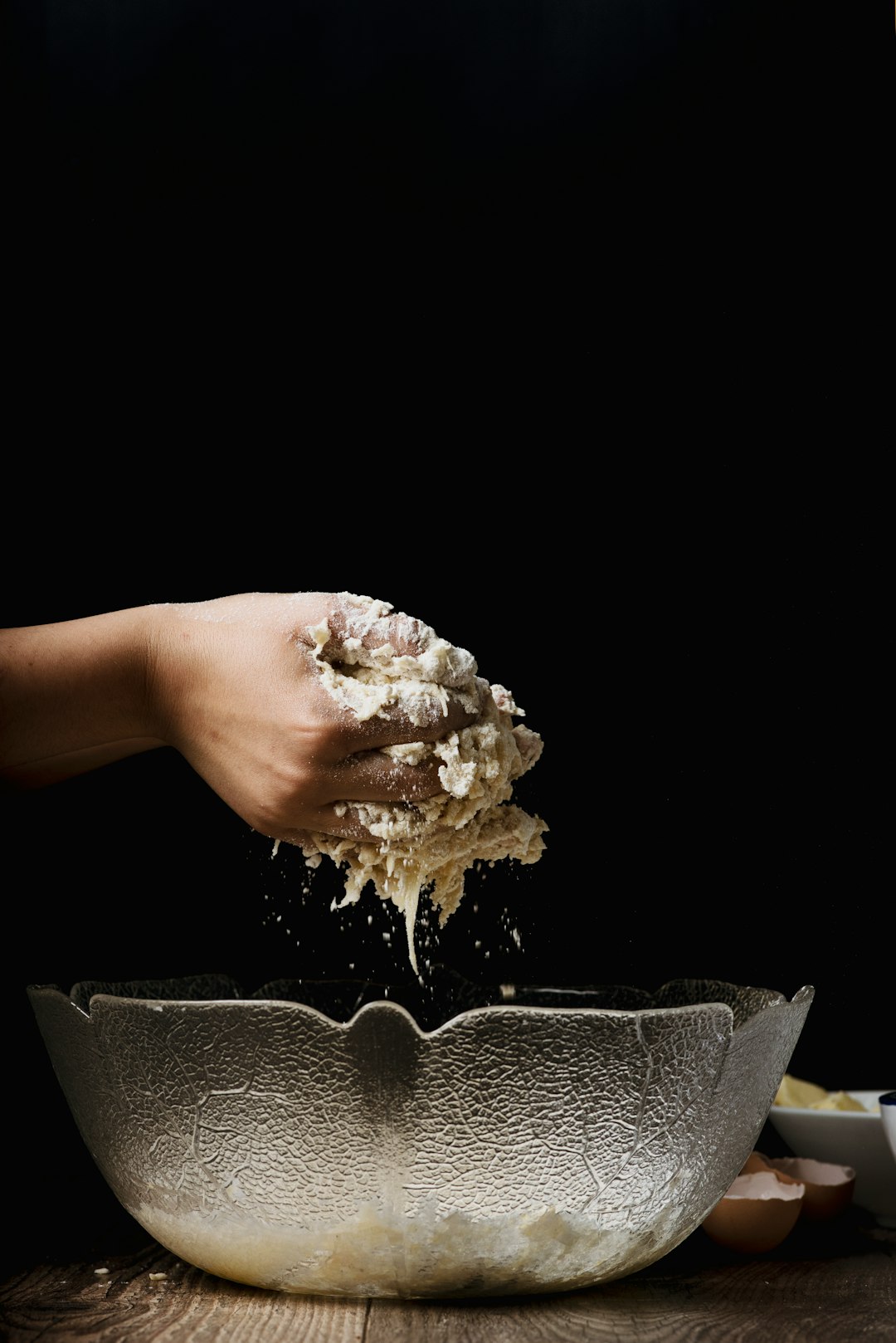 Hand sinking into cornstarch non-Newtonian fluid