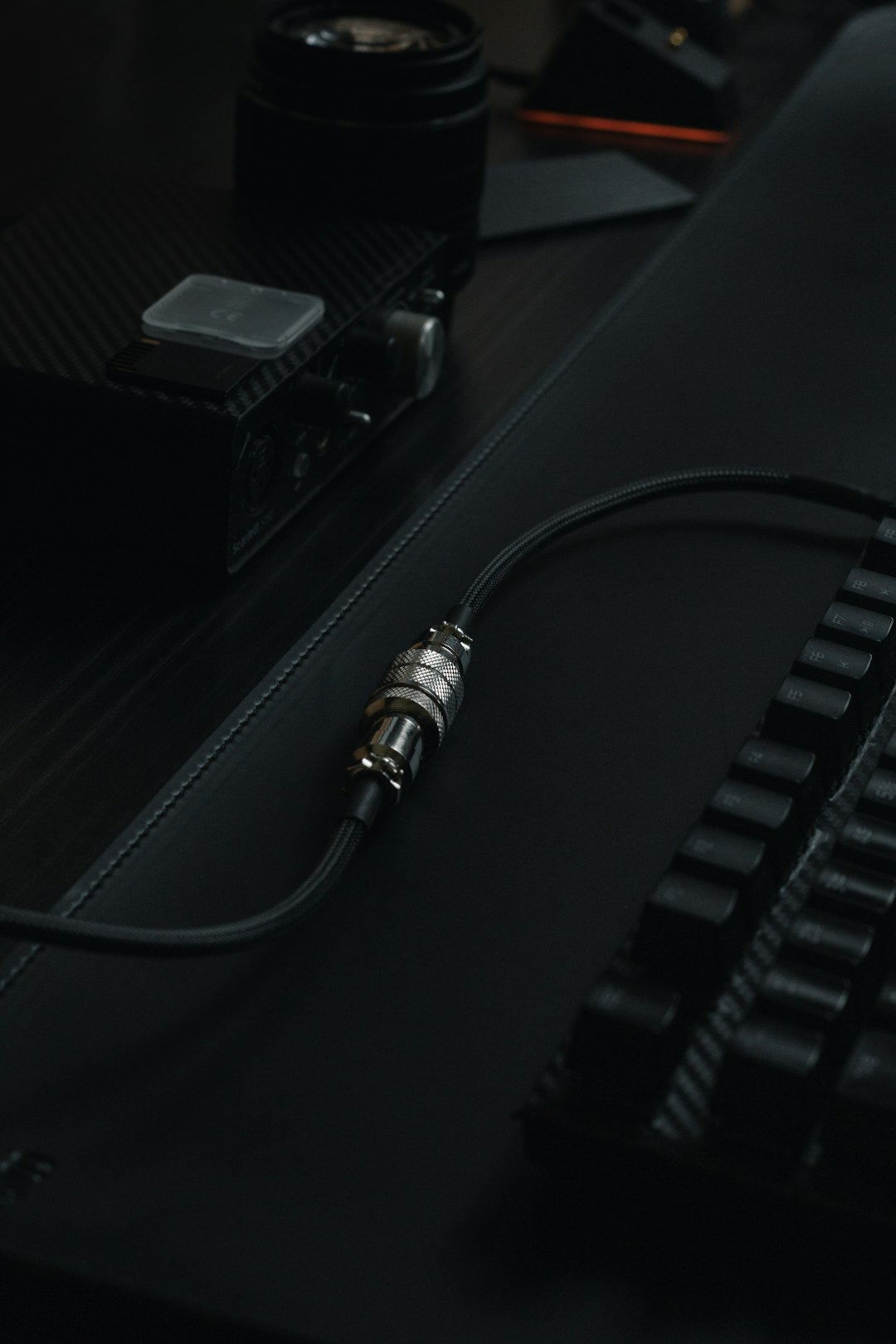 Single USB-C cable coiled on dark slate surface