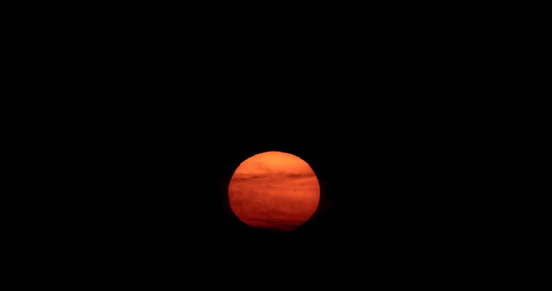 Red giant star looming over a scorched planet surface