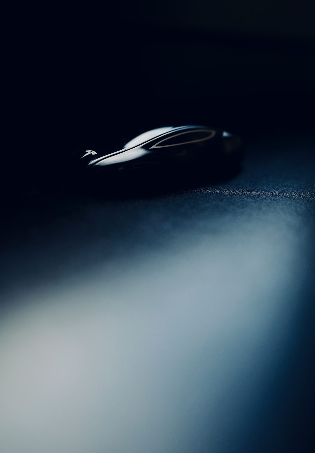 Car key fob hanging from ignition in vehicle