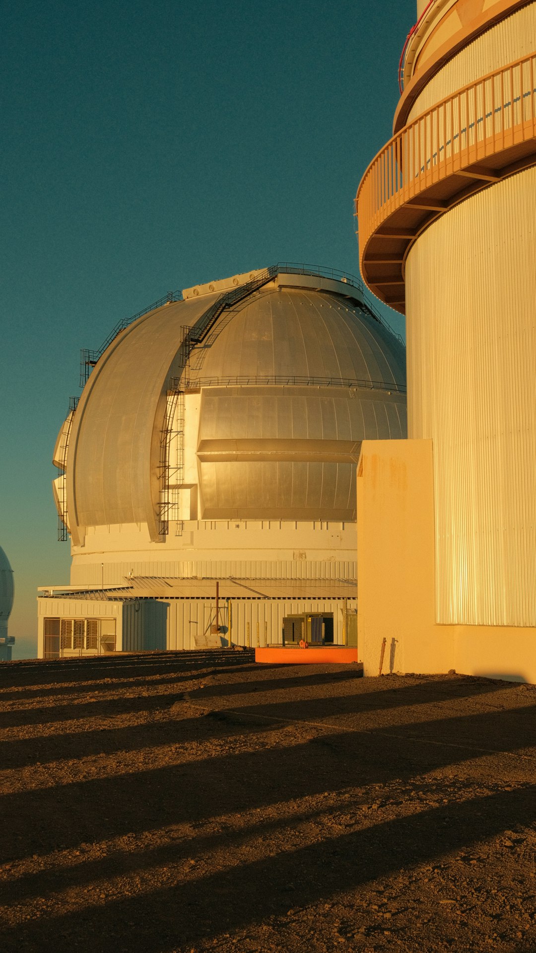 Astronomer silhouette at observatory at twilight