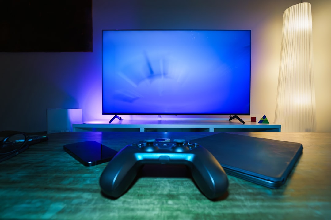 Physical game cases beside a digital game library on TV