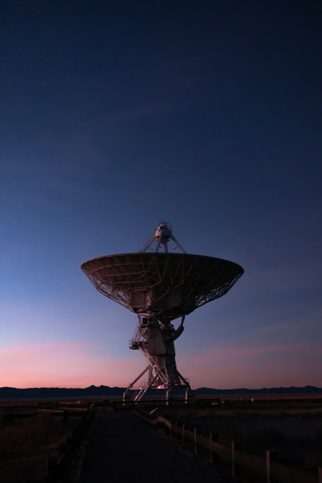 Large deep space network antenna at dusk
