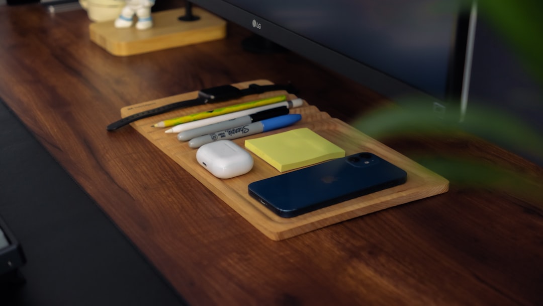 Overhead flat lay of TV remote, phone, and privacy notes