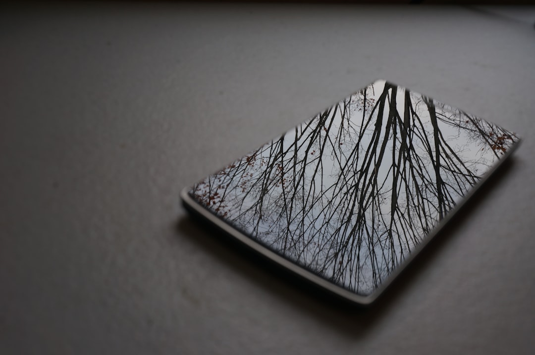 Cracked phone with reminder note to verify calls