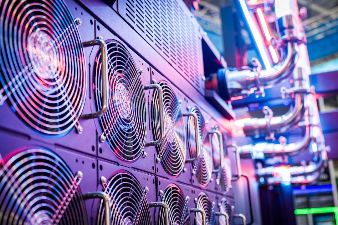 Large server room with illuminated racks stretching into distance