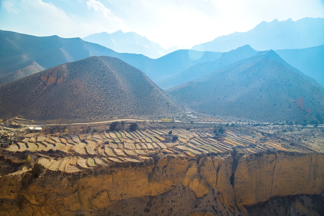 Large open-pit mining operation in mountain landscape