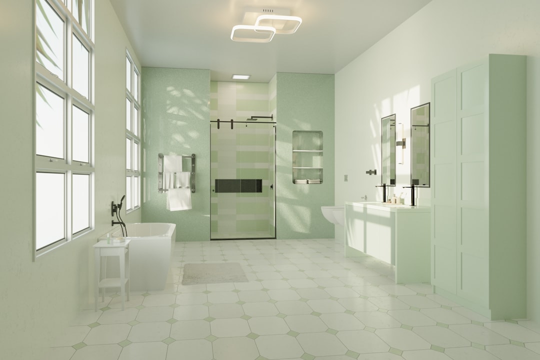 Monochromatic sage green small bathroom with zellige tile shower