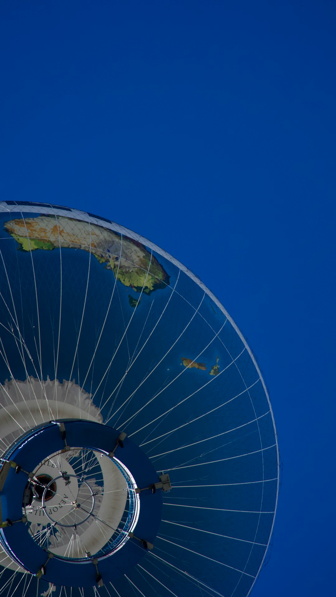 Space telescope in orbit above Earth overhead view