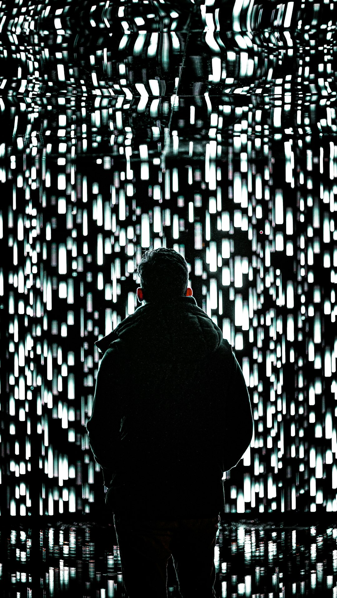 Person facing vast glowing AI memory network wall