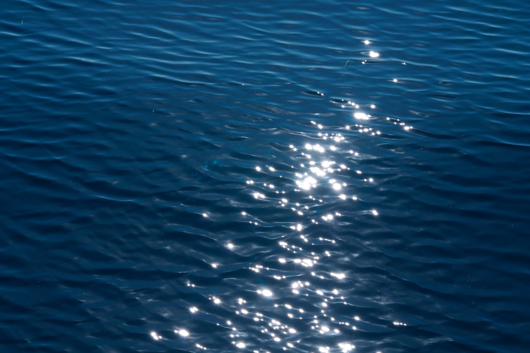 Sunlit ocean surface viewed from underwater depth